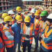 Construction site management with workers collaborating