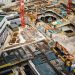 Construction worker managing project risks on jobsite