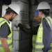 Construction workers using digital tools for daily reporting