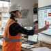 Team using digital forecasting tools on a construction site.