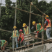 Construction site team using Zepth360 visual reporting on a tablet, showcasing project visuals and data