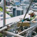 Construction site team using incident reporting software on a digital tablet
