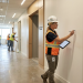 Construction engineers reviewing Non-Conformance Reports on a tablet at a jobsite